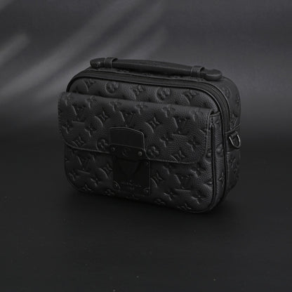 Soft Trunk Messenger Bag – Monogram Black Taurillon